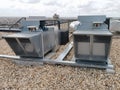 View of air ventilation ducts, extraction and insufflation, HVAC system, and exterior AC units on the building roof