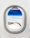 View of aircraft turbine and clouds from airplane window