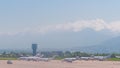 View from the airfield of Almaty on the Zaili Alatau. Various airplanes are parked on the airfield