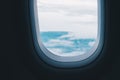 View from the airplace cabin. Airplane window and the outside atmosphere. Royalty Free Stock Photo