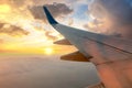 View from airplane on the aircraft white wing flying over desert landscape in sunny morning. Air travel and transportation concept Royalty Free Stock Photo