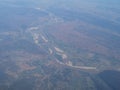 View from airplane at clouds, river under clouds