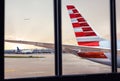 View of airplane fuselage tail through window at airport Royalty Free Stock Photo