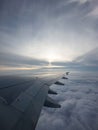 An airplane wing viewed from a passenger window Royalty Free Stock Photo