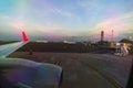 View from the airplane window of the airport taxiway