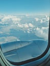 view from airplane window and blue sky with white clouds. soft focus. vertical photo Royalty Free Stock Photo