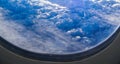 View from airplane window on clouds