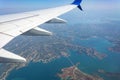 View from the airplane window. Clouds and landscape under the wing Royalty Free Stock Photo