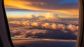 View from airplane window of dramatic sunset clouds over horizon Royalty Free Stock Photo