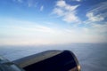 View from airplane window engine and wing flying above the clouds Royalty Free Stock Photo