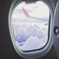 view from the airplane window on feather clouds