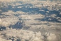 view from airplane window in flight over mountains over Europe Royalty Free Stock Photo