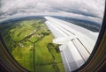 View from airplane window on green fields Royalty Free Stock Photo