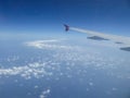 View from airplane window on plane wing and sky with clouds Royalty Free Stock Photo