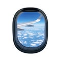 View from an airplane window showcasing a clear blue sky and scattered clouds Royalty Free Stock Photo