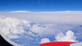 View from the airplane window: snow-white cumulus clouds and blue sky Royalty Free Stock Photo