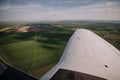 View from the airplane window to green fields Royalty Free Stock Photo