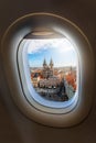 View from an airplane window to the old town and famous Tyn Church of the European city Royalty Free Stock Photo