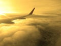 View from airplane window to see sky on Morning sunrise with Wing of an airplane. Royalty Free Stock Photo