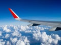 View from airplane windows from passenger, beautiful cloud group and blue sky. Wing aircraft in altitude during flight.Concept of Royalty Free Stock Photo