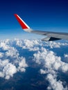 View from airplane windows from passenger, beautiful cloud group and blue sky. Wing aircraft in altitude during flight.Concept of Royalty Free Stock Photo