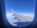 View of IndiGo airplane wing through plane window Royalty Free Stock Photo