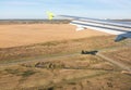 View of airplane wing, Shadow of the plane on the ground during landing, seen from the plane window Royalty Free Stock Photo