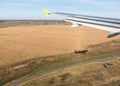 View of airplane wing, Shadow of the plane on the ground during landing, seen from the plane window Royalty Free Stock Photo