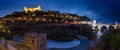 View of Alcantara bridge and the Alcazar of Toledo at night Spain Royalty Free Stock Photo