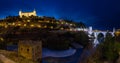 View of Alcantara bridge and the Alcazar of Toledo at night Spain Royalty Free Stock Photo