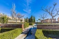 View of the Alcazaba garden with its stairs, small brick walls, and green bushes Royalty Free Stock Photo