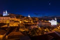 View of the Alfama neighbourhood from the Portas do Sol viewpoint at night in Lisbon, Portugal