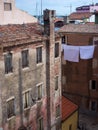 Alley of Chioggia with an old house with brick chimney and sheet Royalty Free Stock Photo