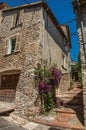 View of alley with house on the slope and flowers in Haut-de-Cagnes