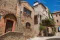 View of alley with houses and flowered creeper in Haut-de-Cagnes.