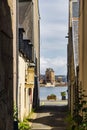 View through an alley to the harbor in Camaret-sur-Mer, France Royalty Free Stock Photo
