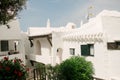 View of the alleys and white architecture and buildings of the fishing village of Binibeca Vell, Menorca, Spain during summer