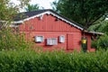 view into a allotment gardens, hedges left and right, roof of tiny houses Royalty Free Stock Photo