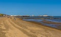 A view along the beach at Clacton on Sea, UK towards the Victorian pier Royalty Free Stock Photo