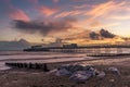 A view along the beach and out to sea at Worthing, Sussex, UK at sunset Royalty Free Stock Photo