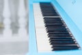 View along a blue piano keyboard