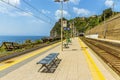 A view along the platform on the station at Corniglia, Italy towards the village Royalty Free Stock Photo