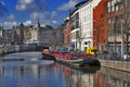 A view along the Rokin Canal in Amsterdam during the day.