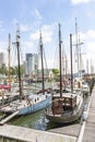 A view along the sailing boats in the Veerhaven on the imposing buildings on the Holland Amerikakade in Rotterdam 3