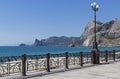 View along the sea shore from the embankment of the resort town. Royalty Free Stock Photo