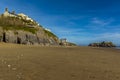 A view along the South Beach of the cliffs and Saint Catherine`s Island in Tenby, Pembrokeshire Royalty Free Stock Photo