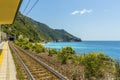 A view along the station platform and coastline at Corniglia, Italy Royalty Free Stock Photo