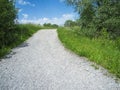 Uphill gravel road in summer Royalty Free Stock Photo