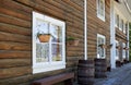 View along the wooden facade of the historic Rika`s Landing Roadhouse, with its white painted window frames Royalty Free Stock Photo