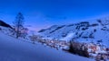 View on alpine village and mountain range, Les deux Alpes at down, blue hour Royalty Free Stock Photo